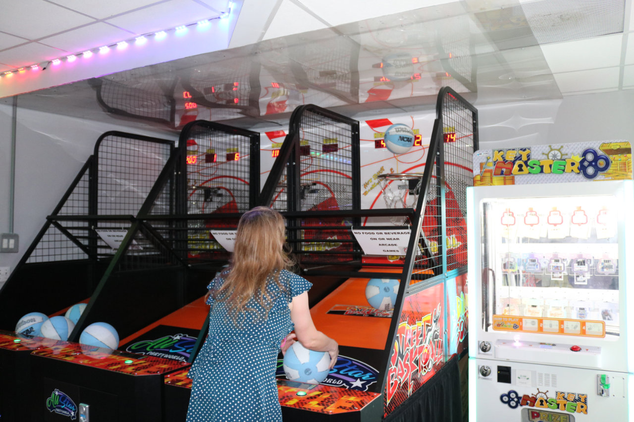 Player at the arcade basketball game at All Star Party World