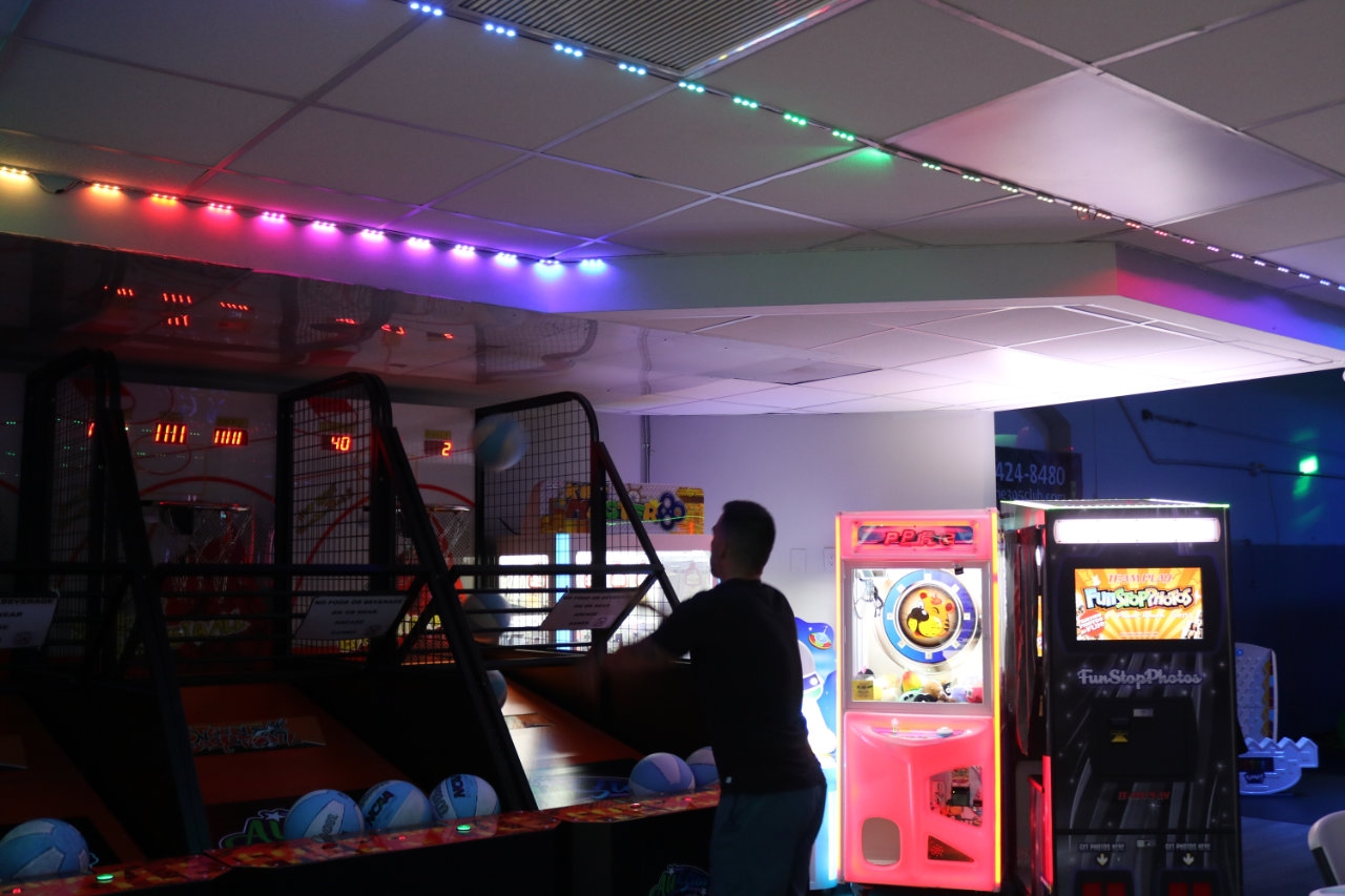 Arcade corner with basketball and crane games at All Star Party World