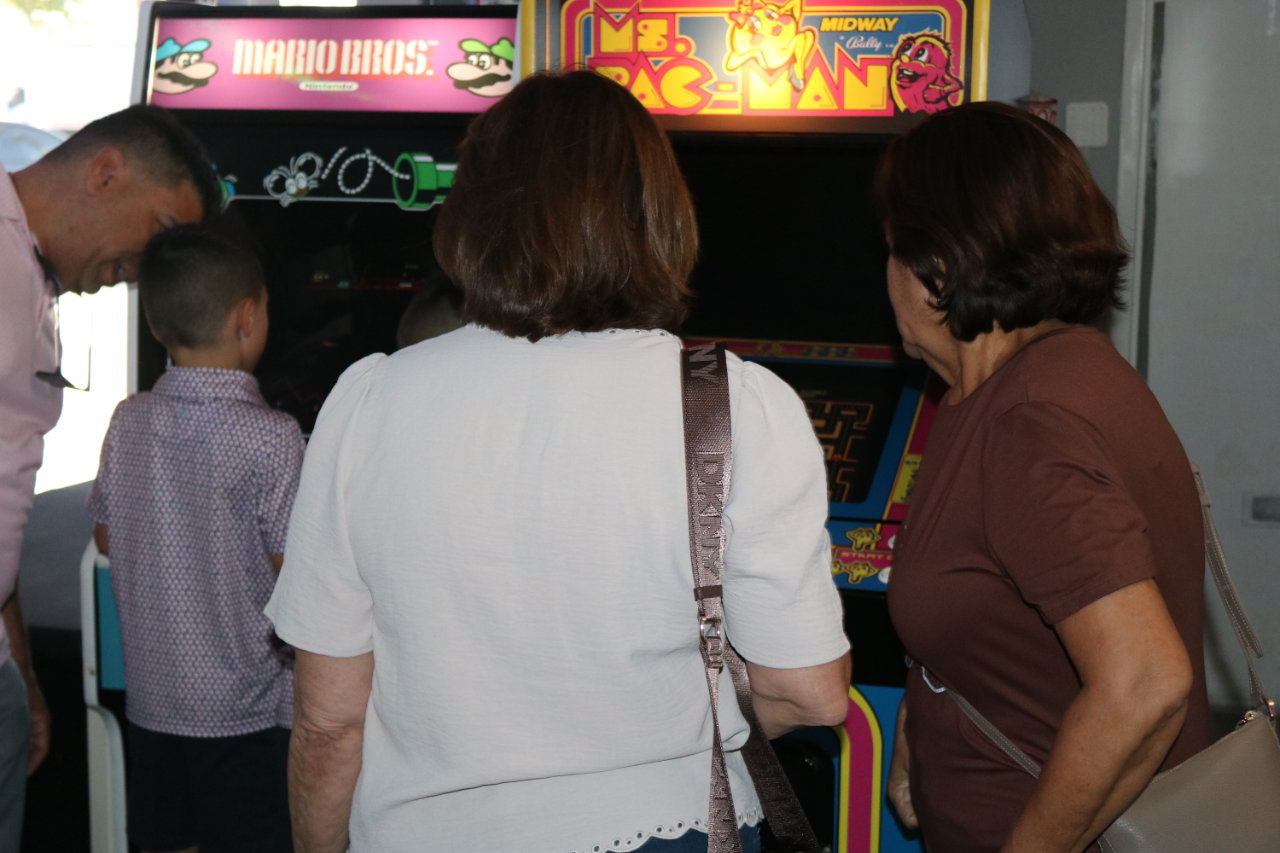 Kids watching arcade games at All Star Party World