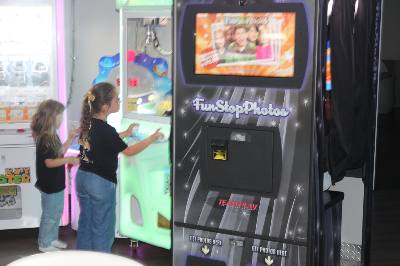 Arcade prize games and photo booth area at All Star Party World