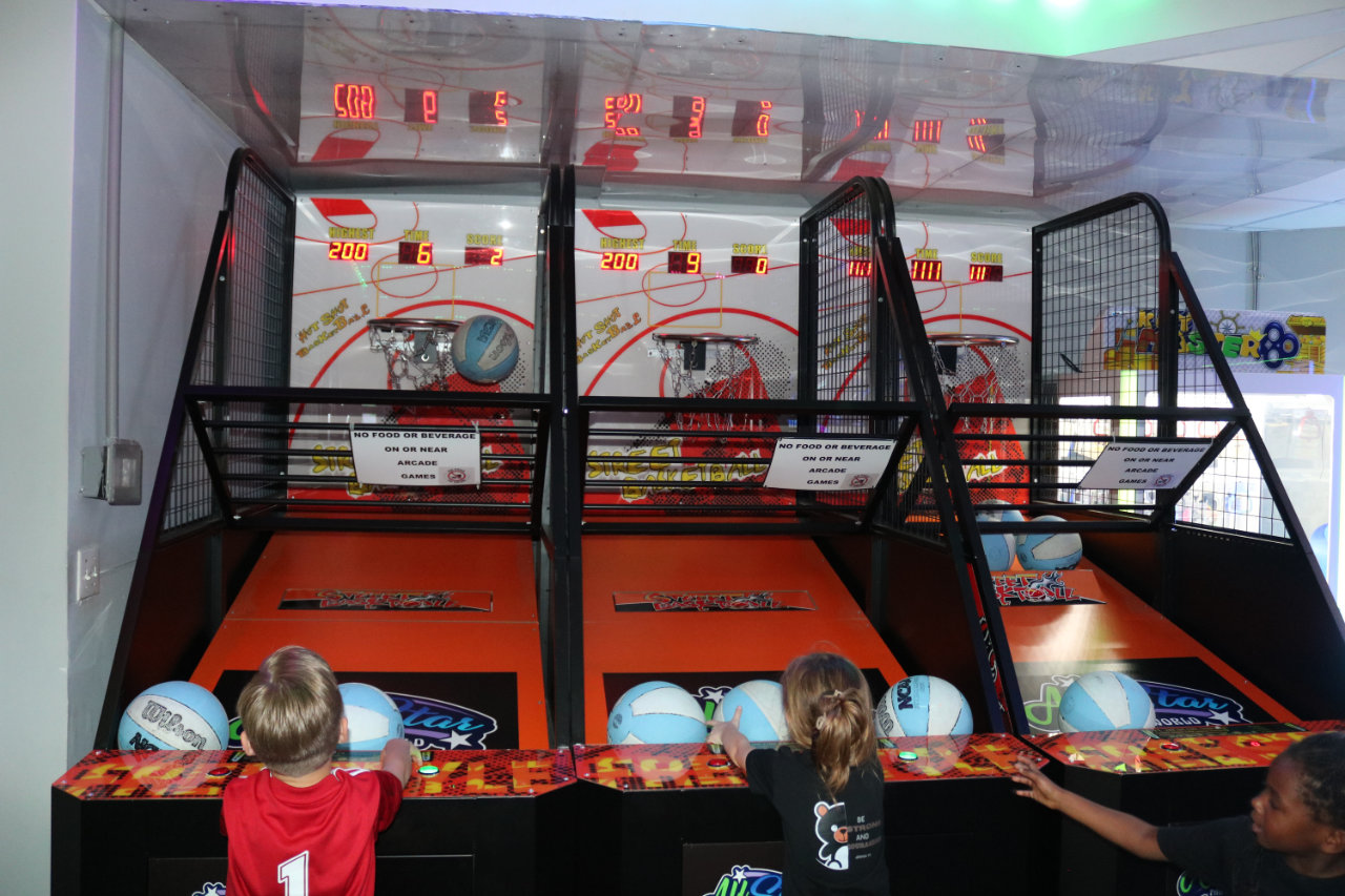 Kids at basketball arcade lanes at All Star Party World