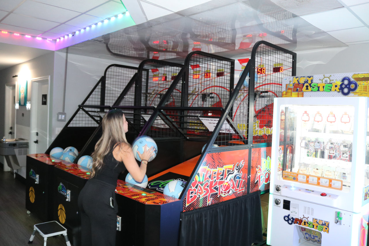 Player at basketball arcade lanes at All Star Party World