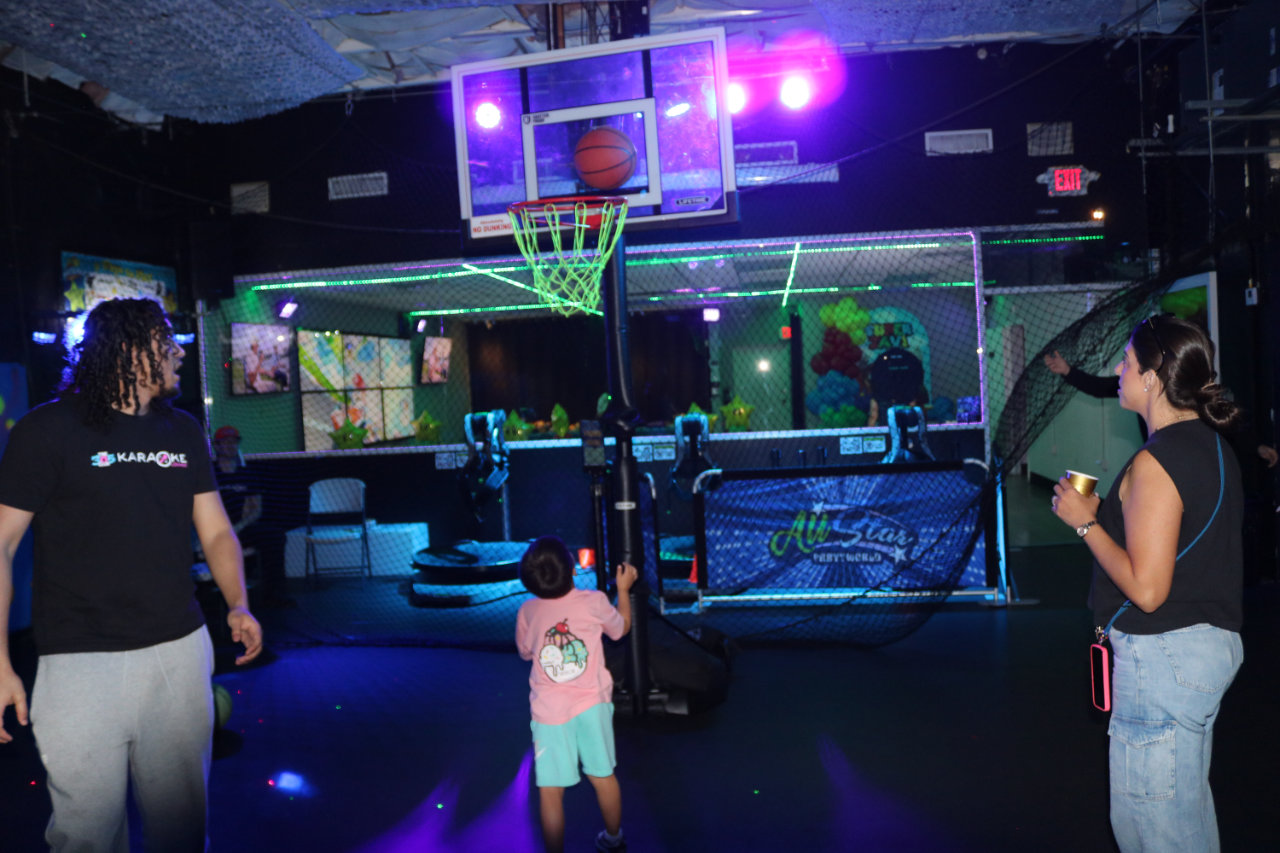 Guests on the basketball court at All Star Party World