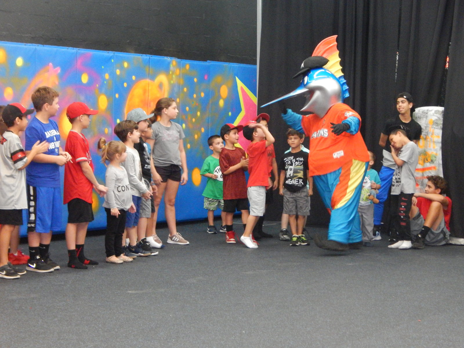 Billy the Marlin mascot with kids at All Star Party World