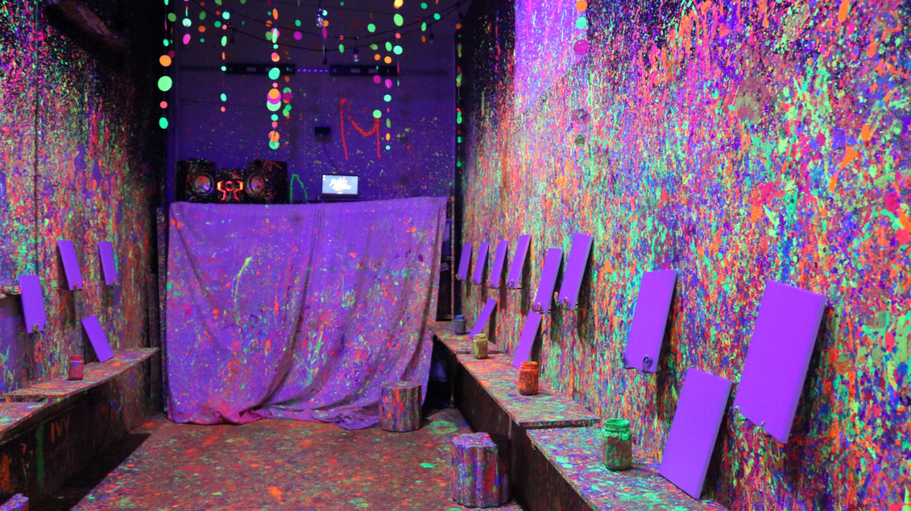 Empty paint splatter room with canvases ready at All Star Party World