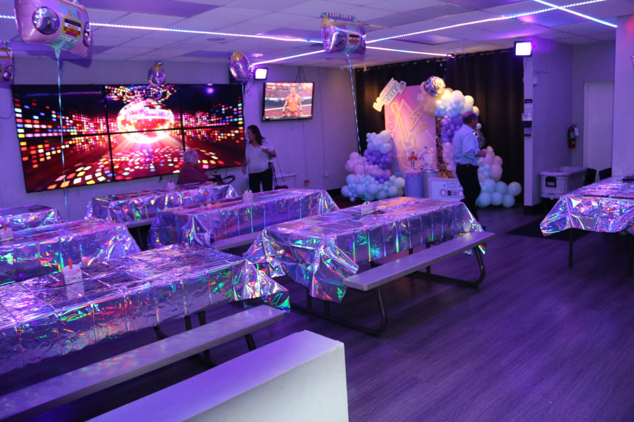 Foil balloon party table setup at All Star Party World