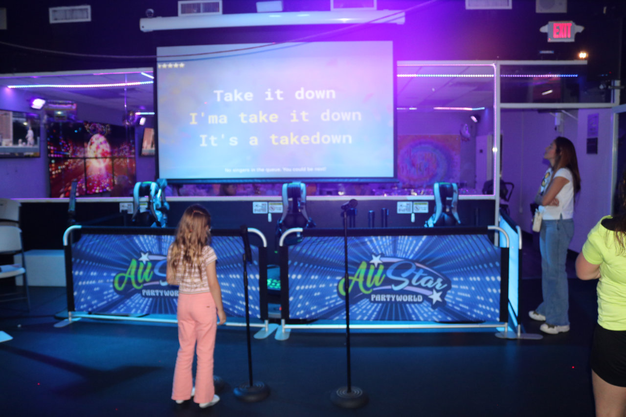 Karaoke stage with lyrics screen at All Star Party World