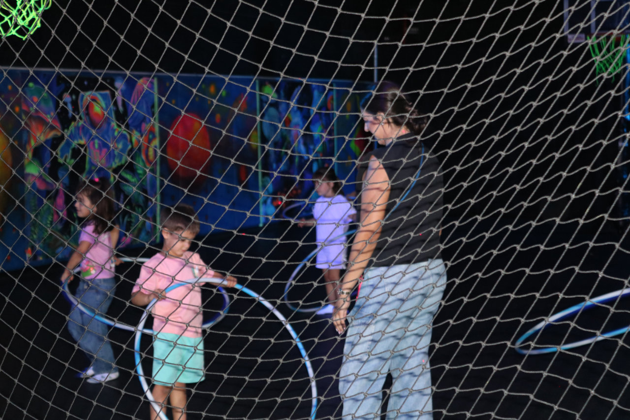 Kids doing hula hoop activity at All Star Party World