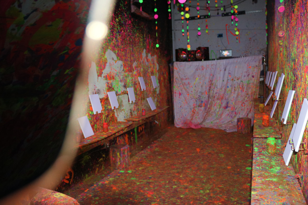 Kids in the paint room with easels at All Star Party World