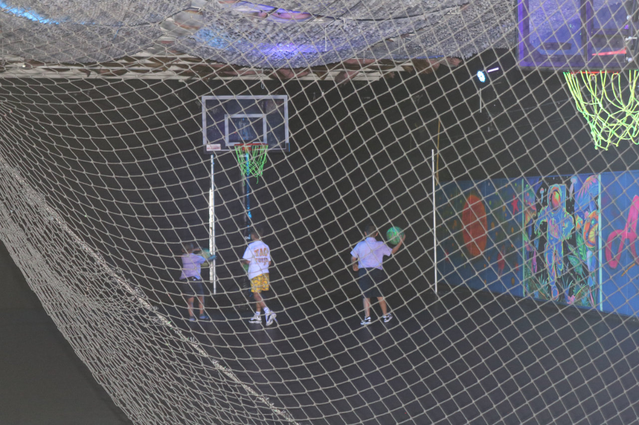 Netted basketball court at All Star Party World