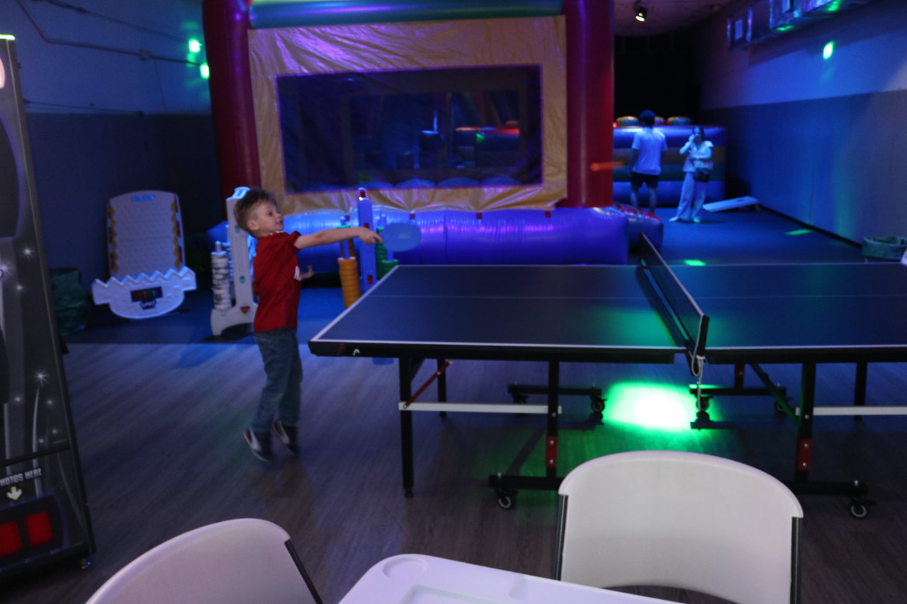 Ping pong table near the bounce house at All Star Party World