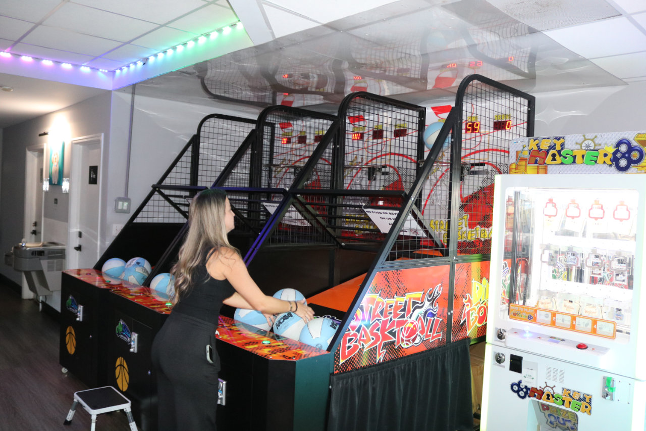 Player at basketball arcade lanes at All Star Party World