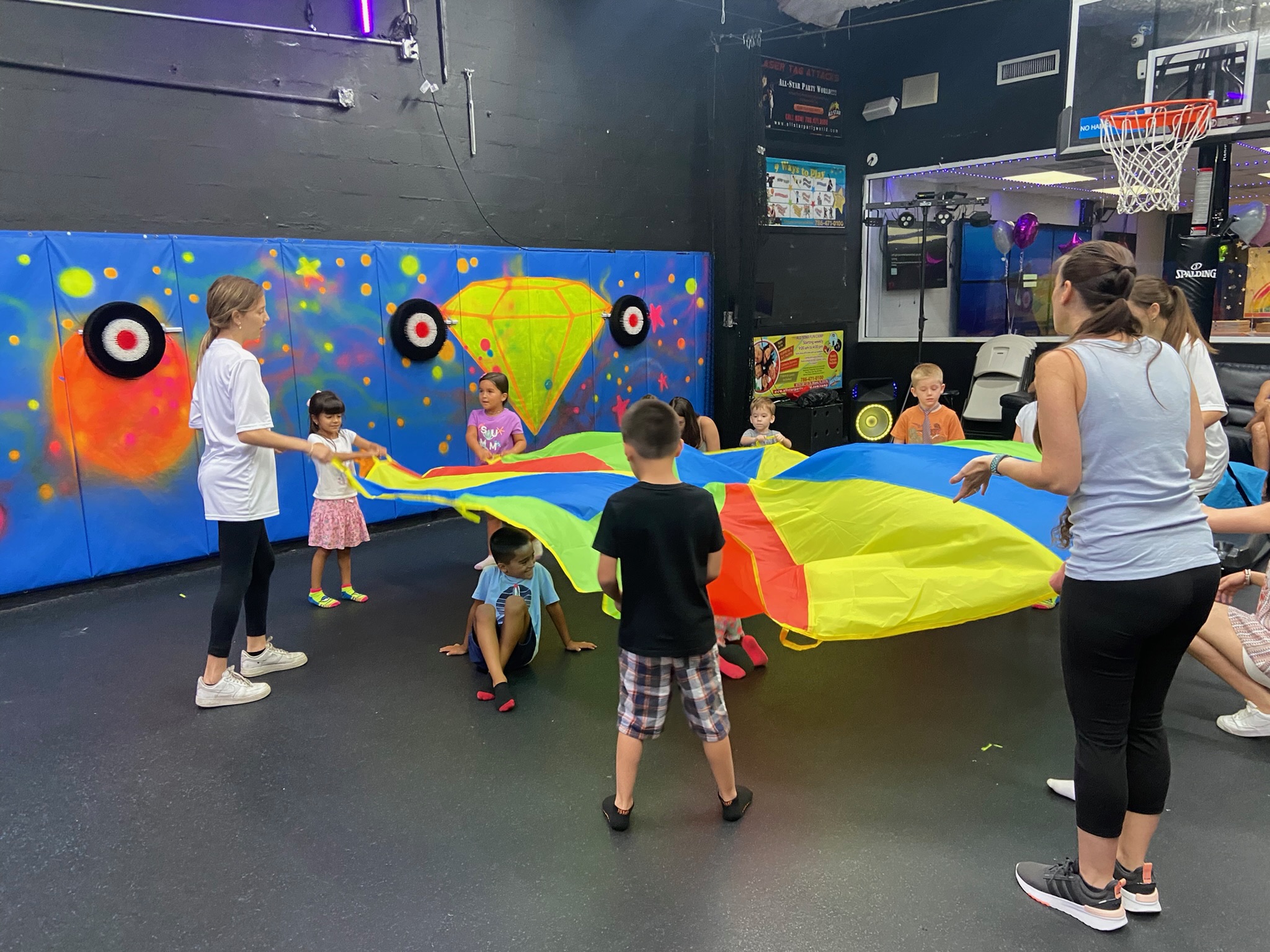 Kids enjoying parachute game party activity