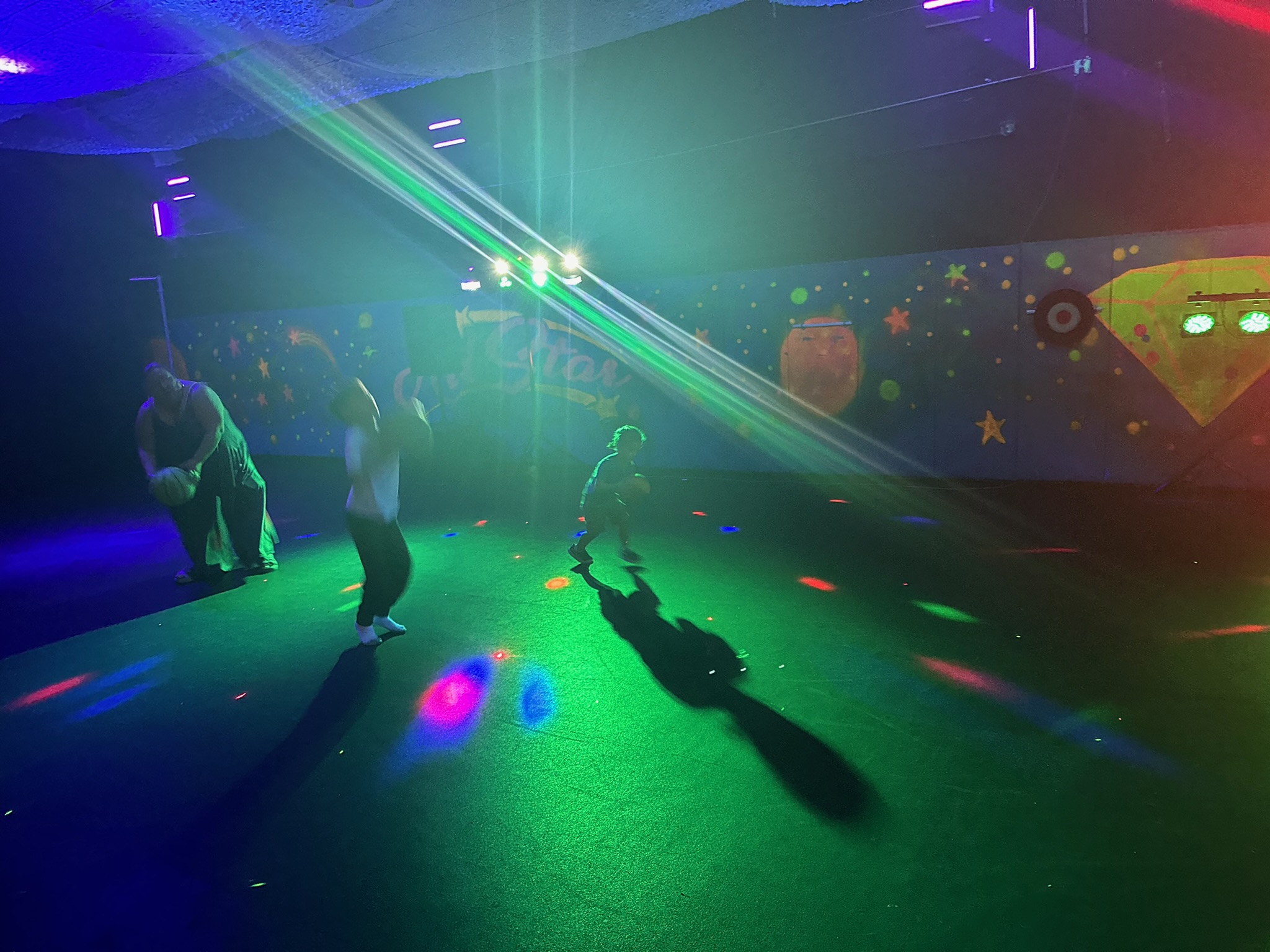 Laser light show on the dance floor during a kids party at All Star Party World