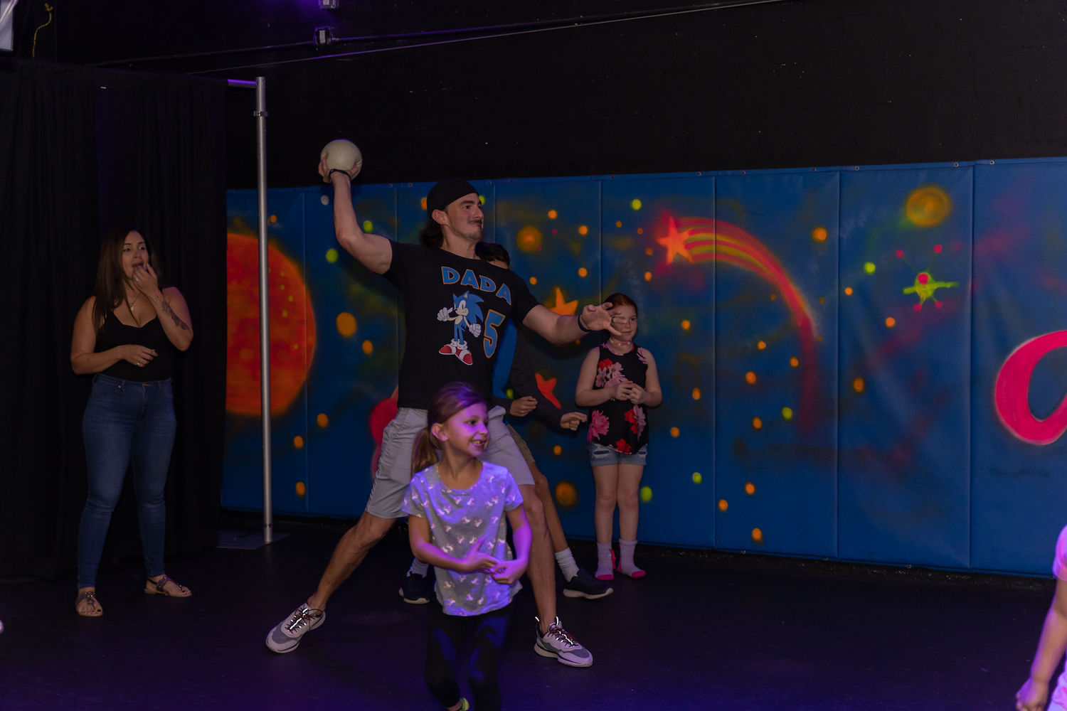 Kids playing glow dodgeball at All Star Party World Miami
