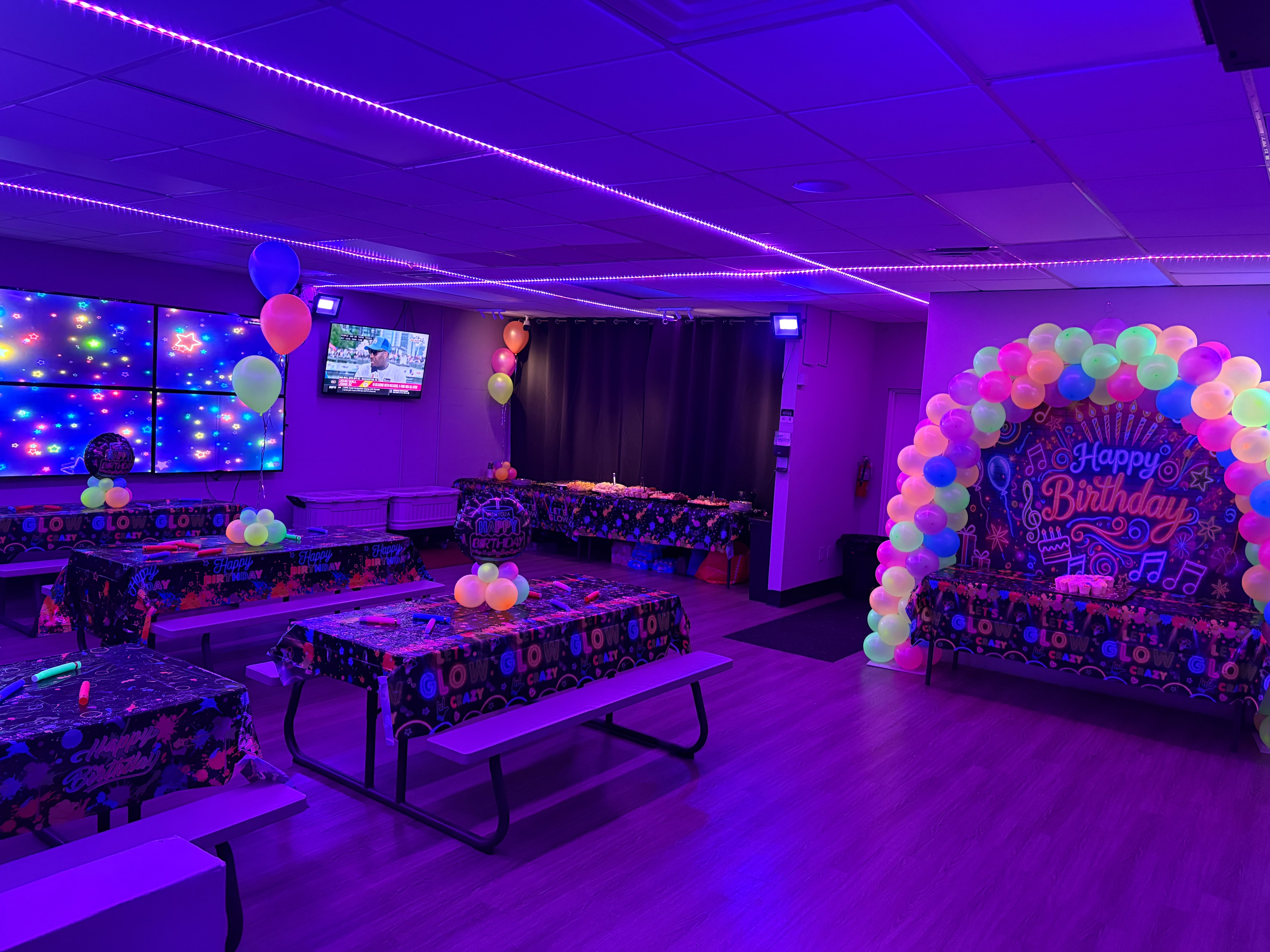 Kids glow party in blacklight room at All Star Party World Miami